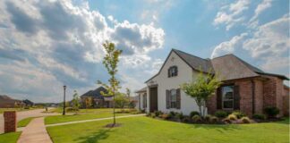 How to Enhance Safety and Accessibility Through Strategic Commercial Landscape Design? White and brown house near green grass