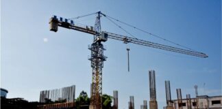 Effective Time Management Tips for Successful Construction Projects A construction site with a crane in the background