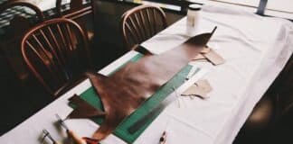 How Can You Give Your Furniture a Vintage Feel with These Timeless Additions? Brown leather textile on top of drafting board