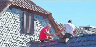 Shingle Smarts: 6 Tips for Maintaining a Strong, Leak-Free Roof Two men working on the roof of a house